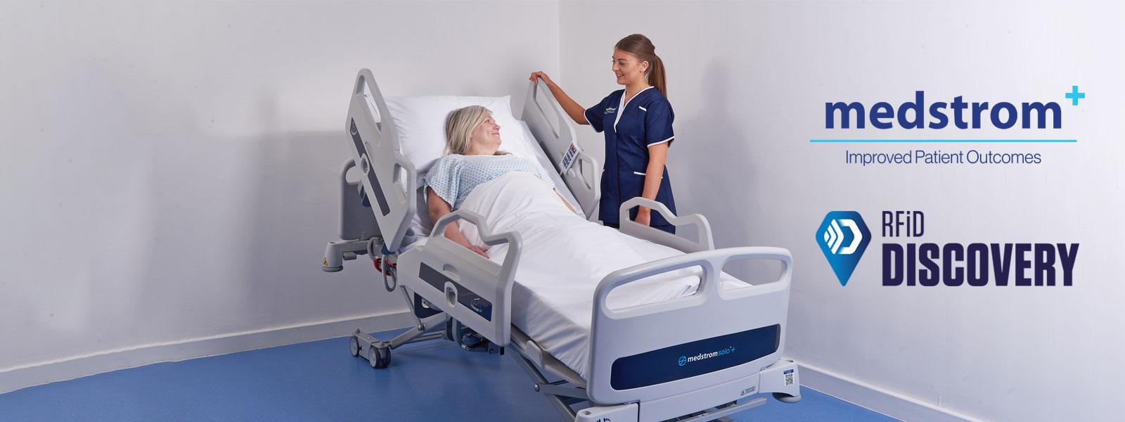 Patient in hospital bed with nurse