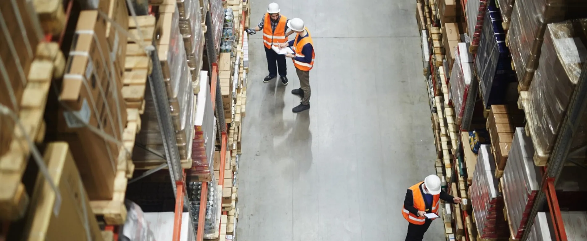 Warehouse workers in aisle