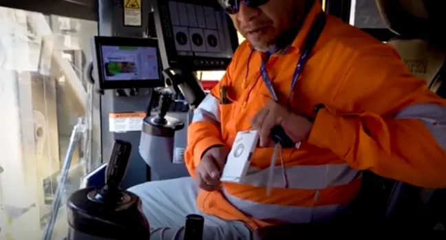 Lone worker wearing RFID Discovery tracking tag with emergency alert function