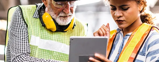 Workers looking at a tablet